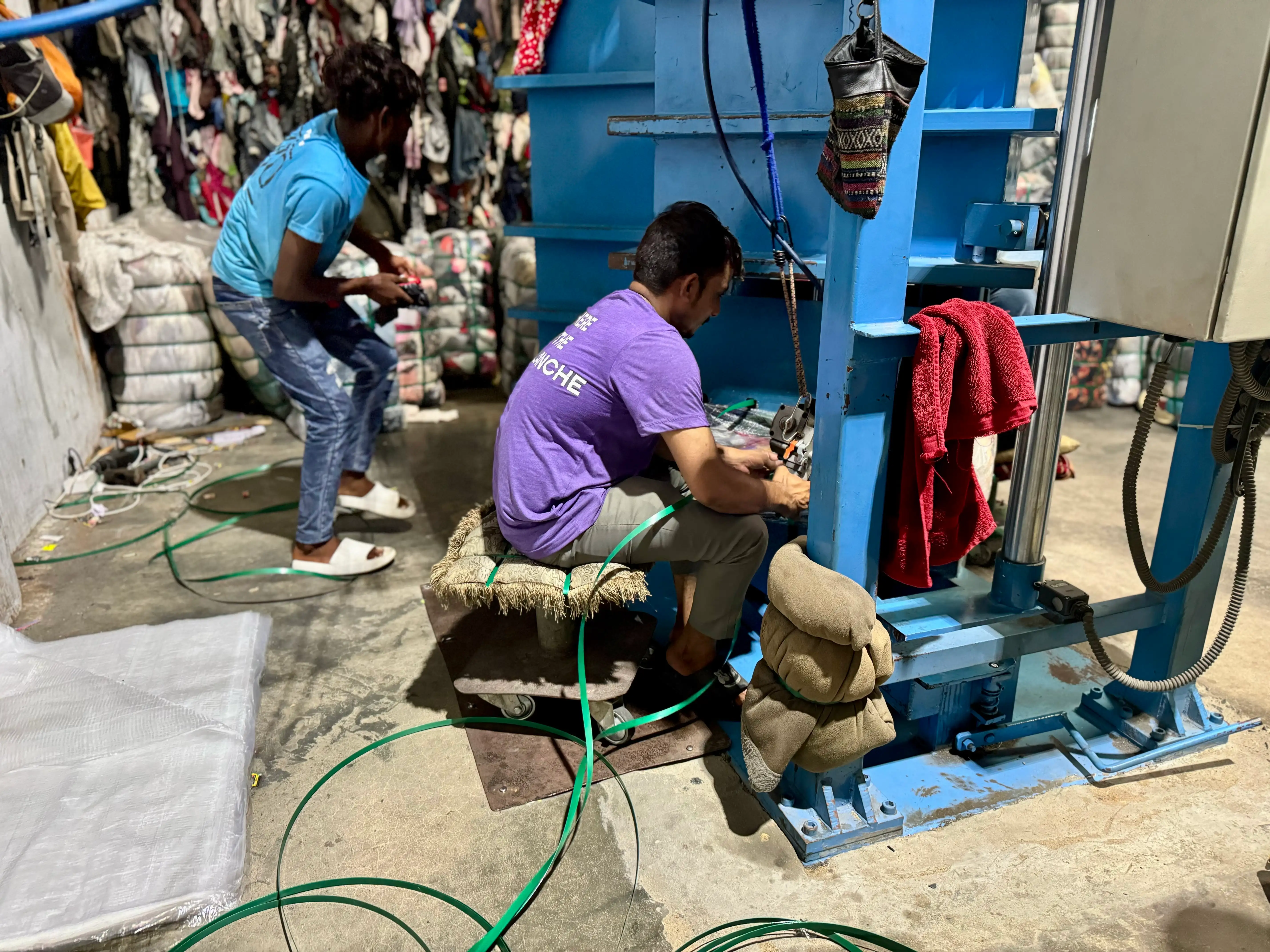 used clothing cut wiper vintage being compressed and packed into bales